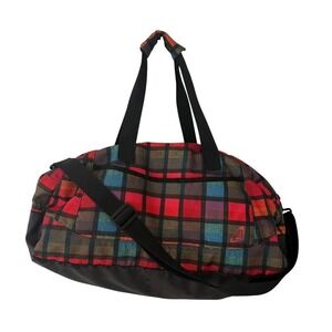 Vintage Roxy duffel bag in a bold multicolor plaid pattern with black base y2k